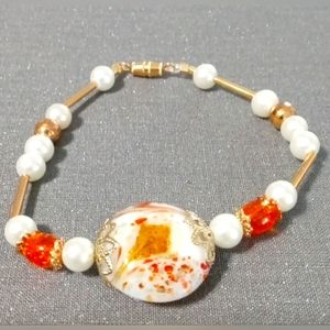 Cute white, orange, and gold bracelet (homemade)